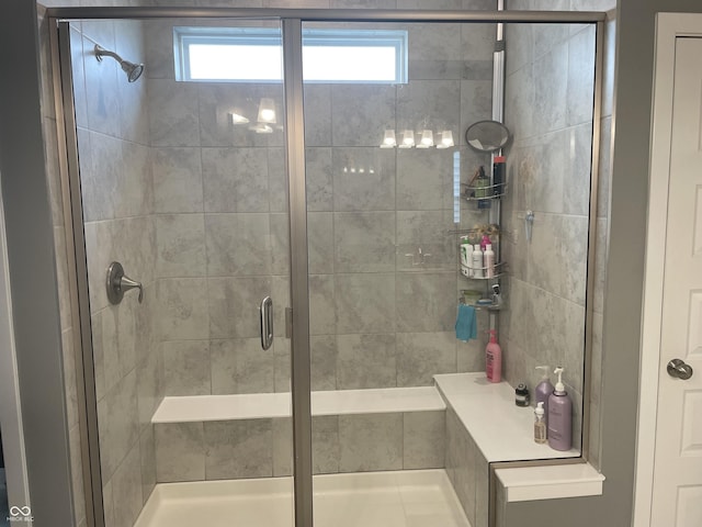 bathroom with a shower stall