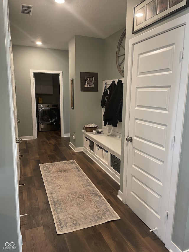 mudroom with visible vents, baseboards, washer / dryer, and dark wood-style flooring