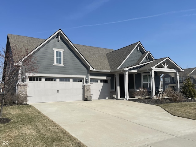 view of front of property featuring a garage and concrete driveway