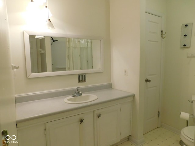 full bathroom with tile patterned floors, toilet, and vanity