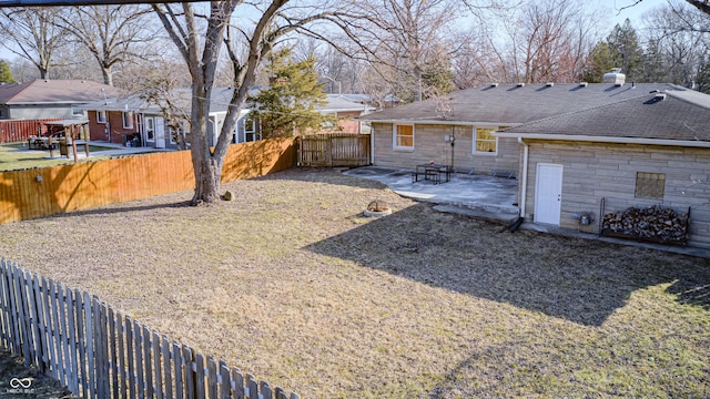 view of yard featuring a fenced backyard and a patio