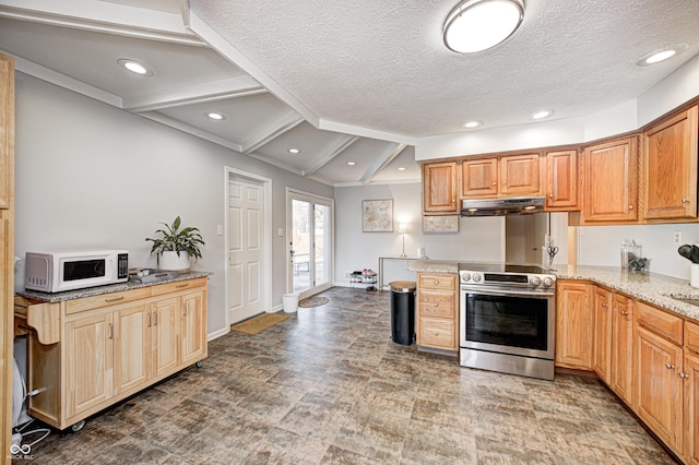 kitchen with light stone counters, white microwave, electric range, under cabinet range hood, and a textured ceiling