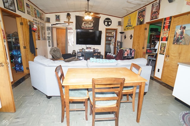 dining room featuring a ceiling fan and vaulted ceiling