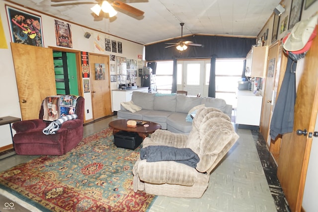 living room featuring baseboards, lofted ceiling, and a ceiling fan