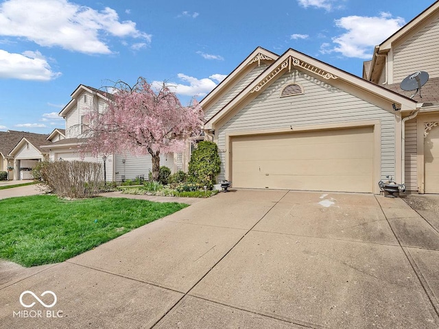 6556 Aintree Ter, Indianapolis, IN 46250 - view of front of house with a front lawn, driveway, and an attached garage