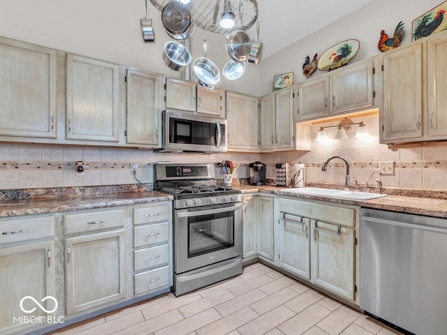 6556 Aintree Ter, Indianapolis, IN 46250 - kitchen featuring appliances with stainless steel finishes, backsplash, and a sink
