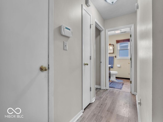 6556 Aintree Ter, Indianapolis, IN 46250 - corridor with light wood-style floors, visible vents, and baseboards