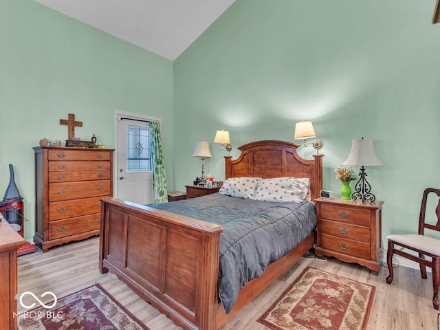 6556 Aintree Ter, Indianapolis, IN 46250 - bedroom featuring light wood-style floors and high vaulted ceiling