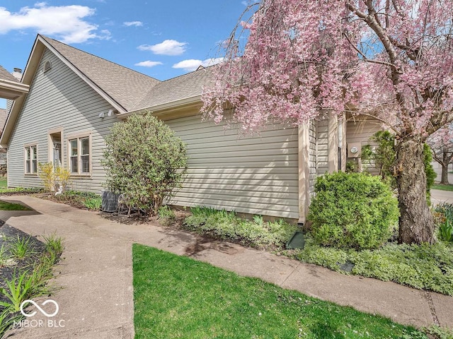 6556 Aintree Ter, Indianapolis, IN 46250 - view of side of property with roof with shingles