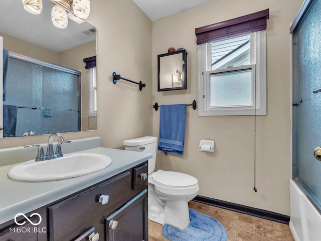 6556 Aintree Ter, Indianapolis, IN 46250 - bathroom with shower / bath combination with glass door, toilet, vanity, baseboards, and visible vents