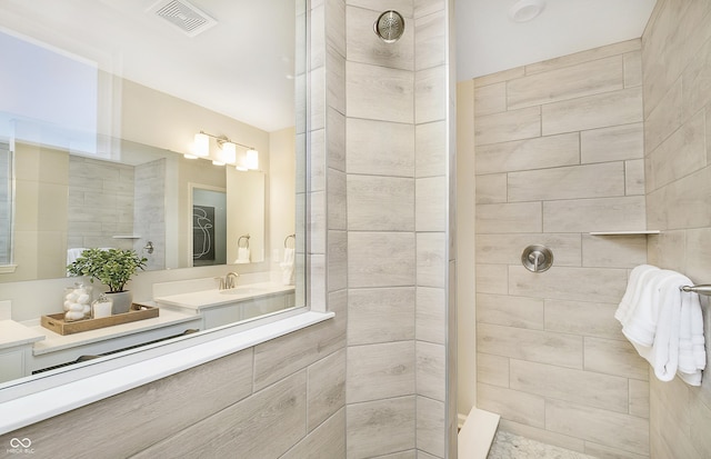 full bath with visible vents, a walk in shower, and vanity