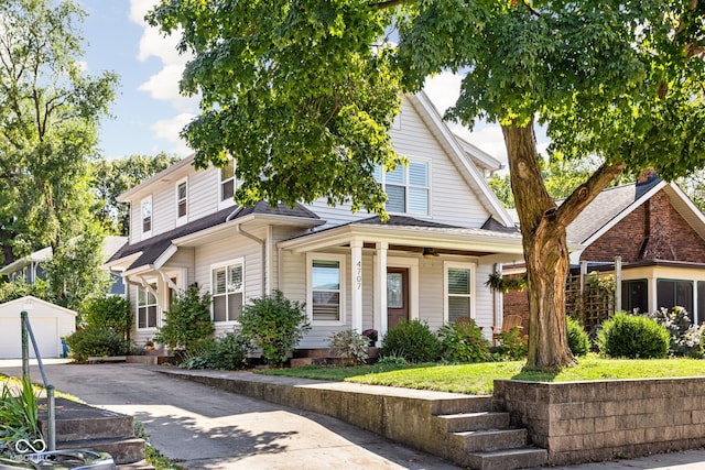 view of front facade featuring a garage, an outdoor structure, and driveway