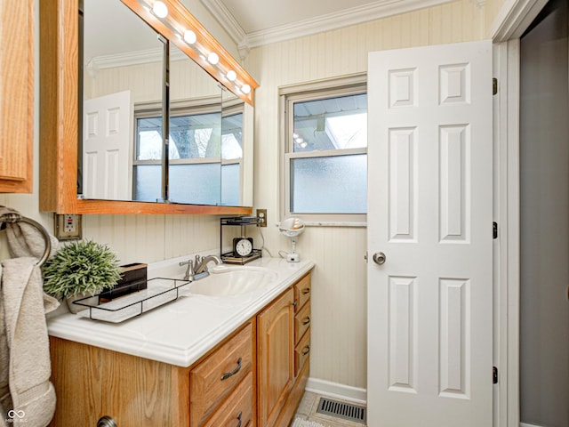 bathroom with vanity, visible vents, and ornamental molding