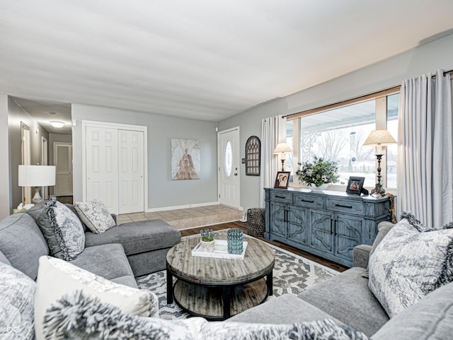 living room featuring baseboards