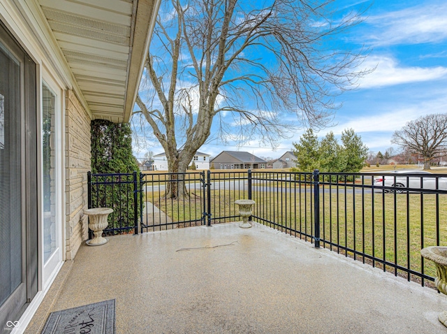 view of patio / terrace featuring a balcony and a residential view