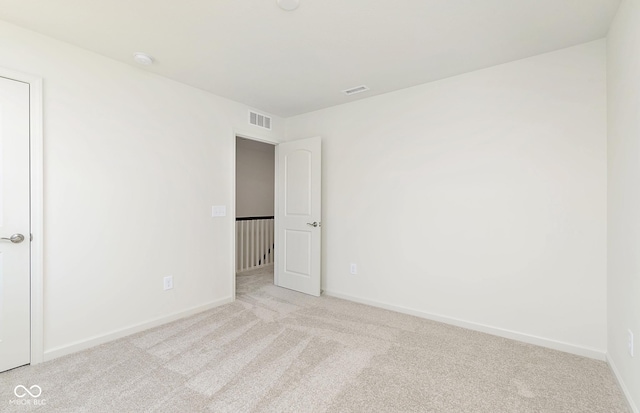 unfurnished bedroom with visible vents, baseboards, and carpet flooring