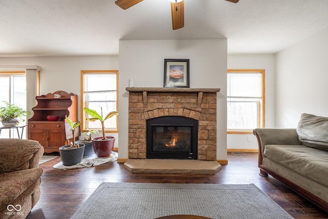 living room featuring plenty of natural light, a ceiling fan, and hardwood / wood-style flooring