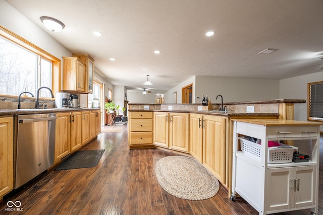 kitchen with dishwasher, a sink, dark wood-style flooring, and ceiling fan