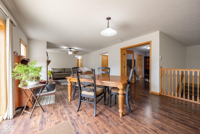 dining room featuring a ceiling fan, wood finished floors, and baseboards