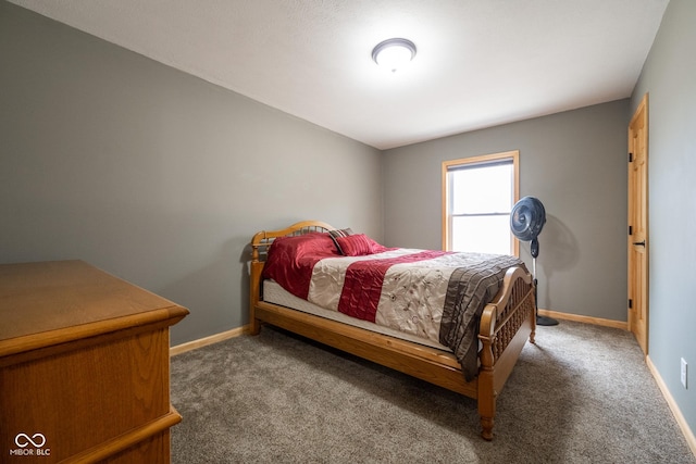 carpeted bedroom featuring baseboards