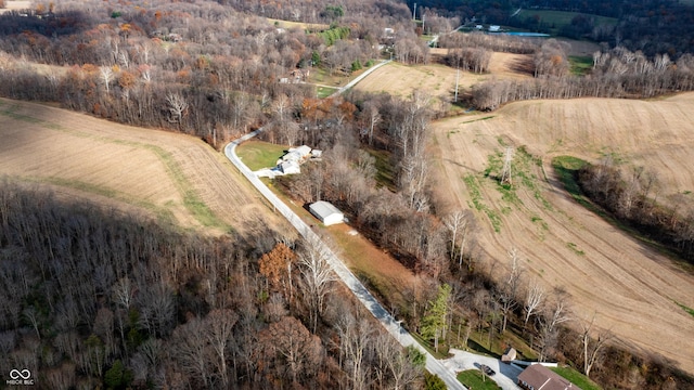 birds eye view of property with a rural view