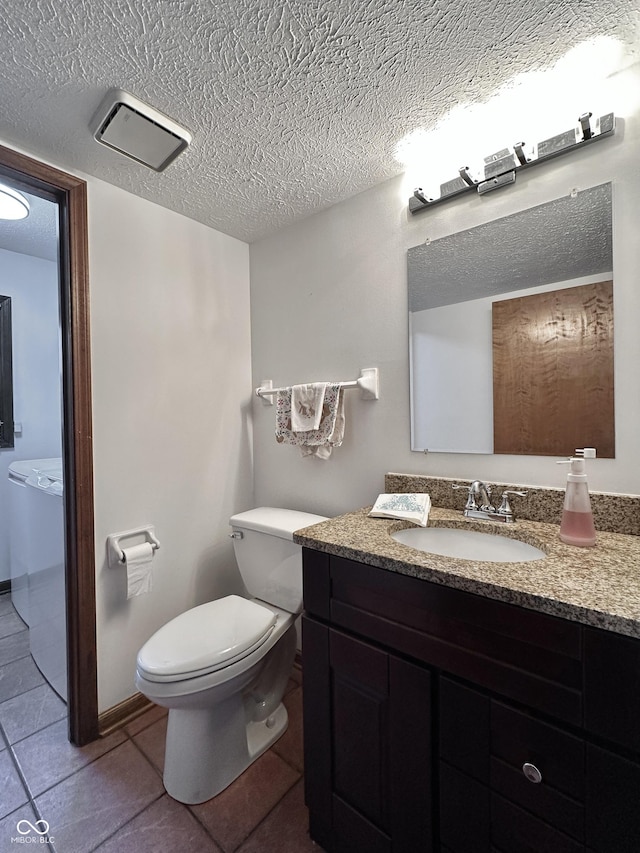 bathroom featuring visible vents, toilet, a textured ceiling, tile patterned flooring, and vanity