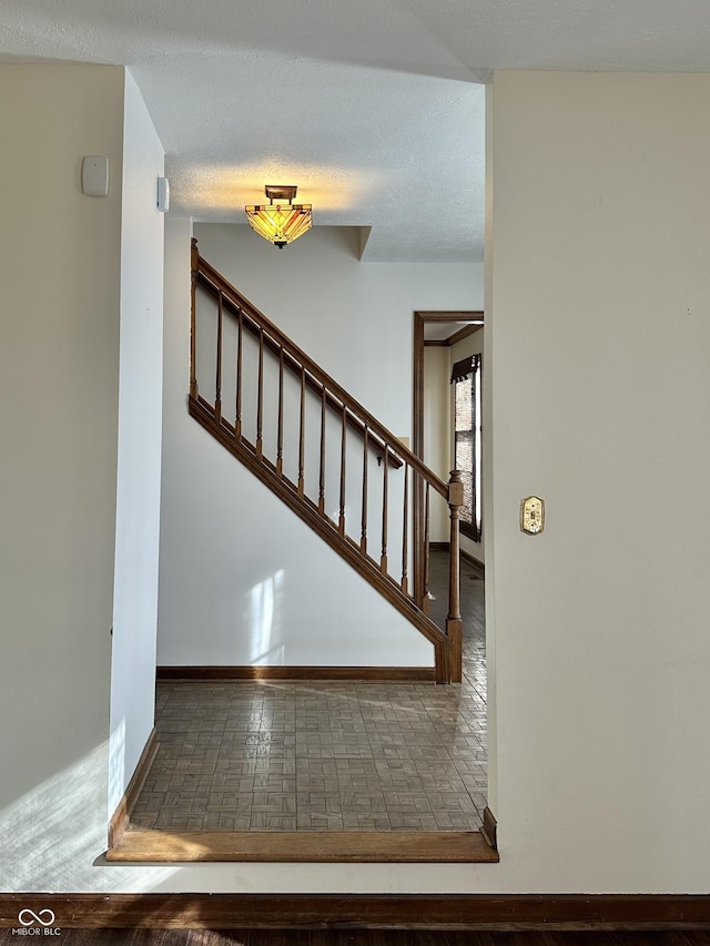 stairs featuring baseboards