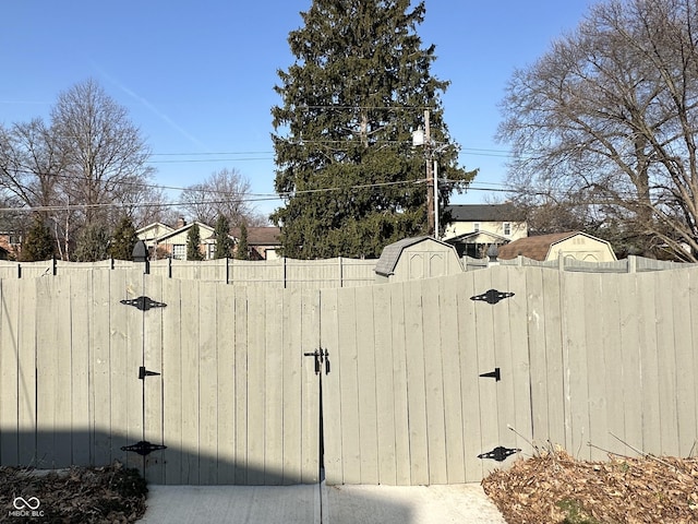 view of yard with fence and a gate