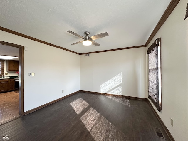 unfurnished room featuring a ceiling fan, visible vents, and a wealth of natural light