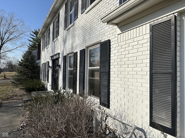 view of home's exterior with brick siding