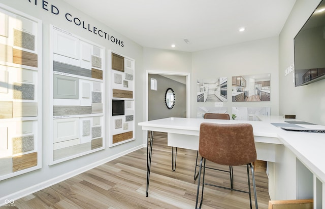 office featuring recessed lighting, baseboards, and light wood-style flooring