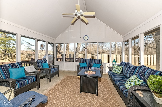 sunroom / solarium featuring ceiling fan and vaulted ceiling