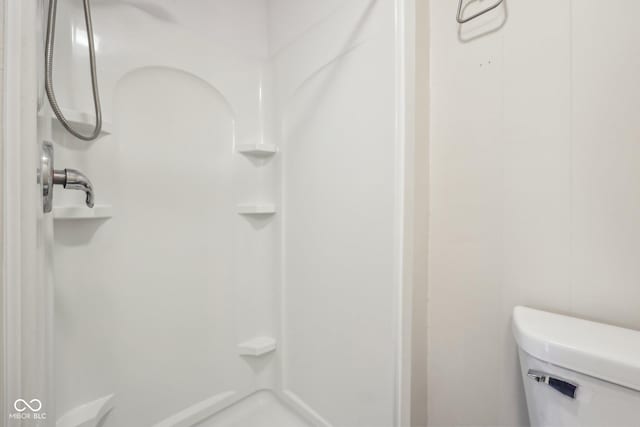 full bathroom with toilet and a shower