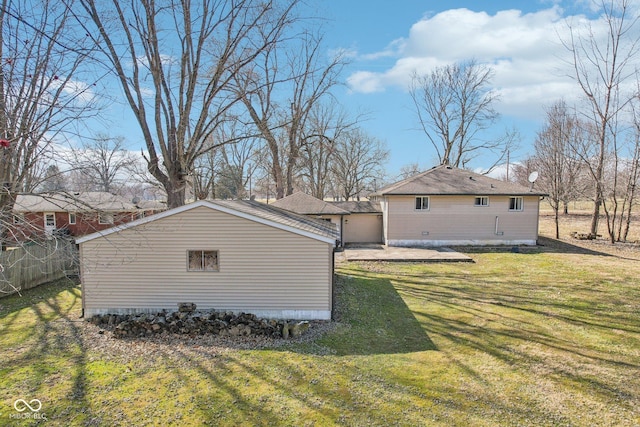 exterior space featuring an outbuilding and a lawn