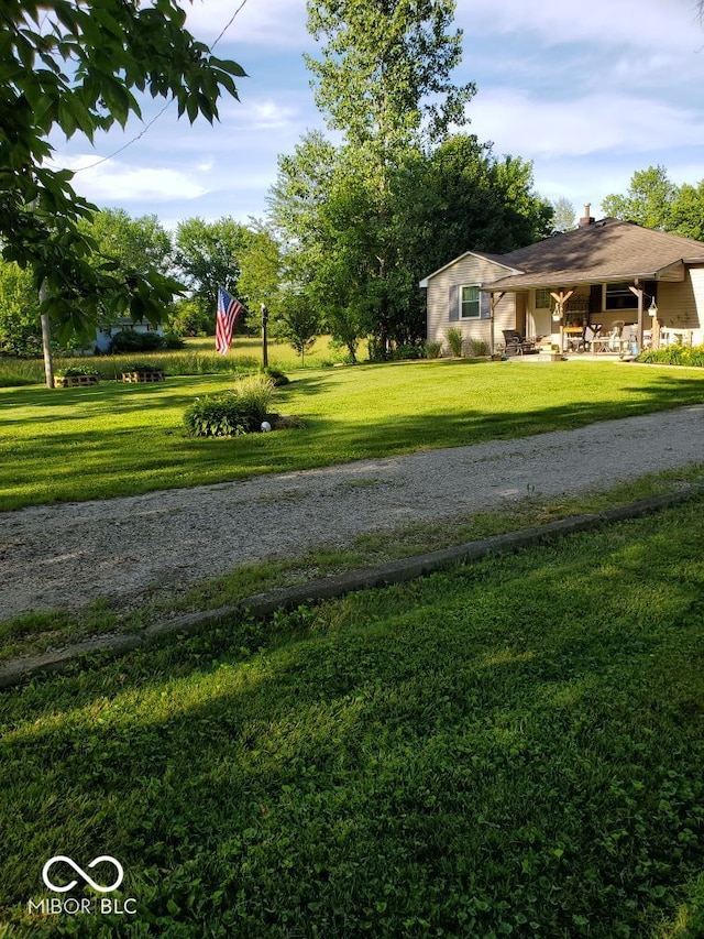 view of property's community featuring a lawn