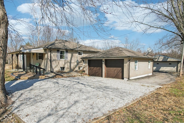 view of front of house featuring an outbuilding and a shingled roof