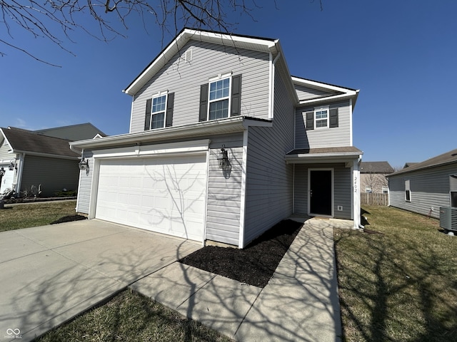 traditional-style house featuring central AC unit, driveway, a front lawn, and a garage