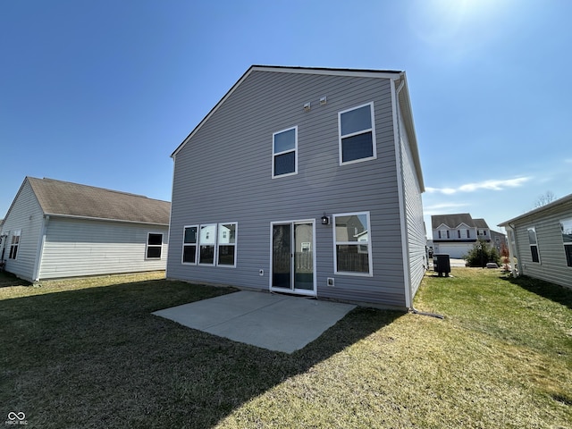 rear view of house with a patio area, central AC unit, and a yard