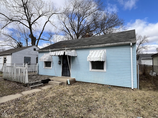 view of front of home with a wooden deck and a chimney