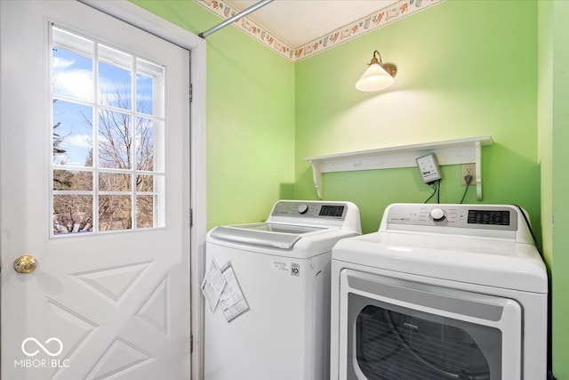 clothes washing area with laundry area and separate washer and dryer