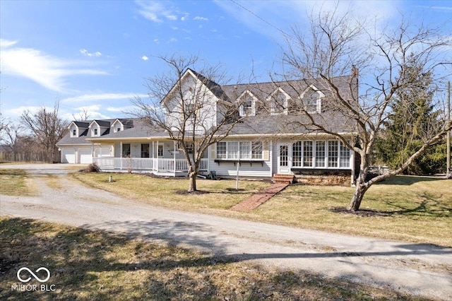 new england style home featuring covered porch, a front yard, and dirt driveway