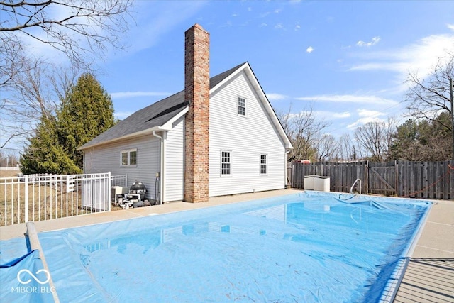 view of pool featuring a fenced in pool and a fenced backyard