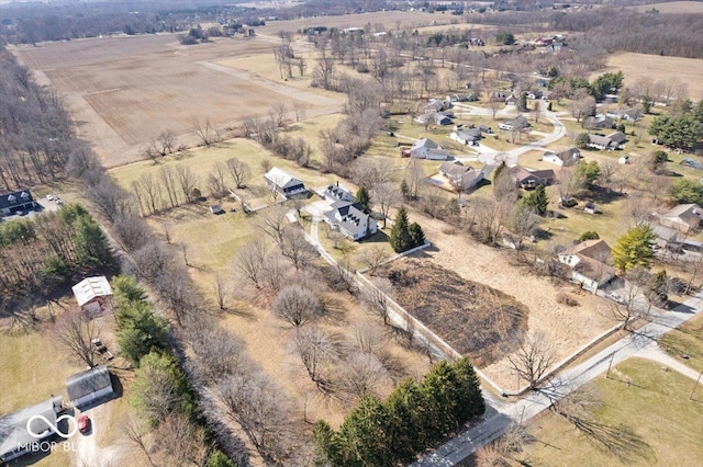 birds eye view of property with a rural view