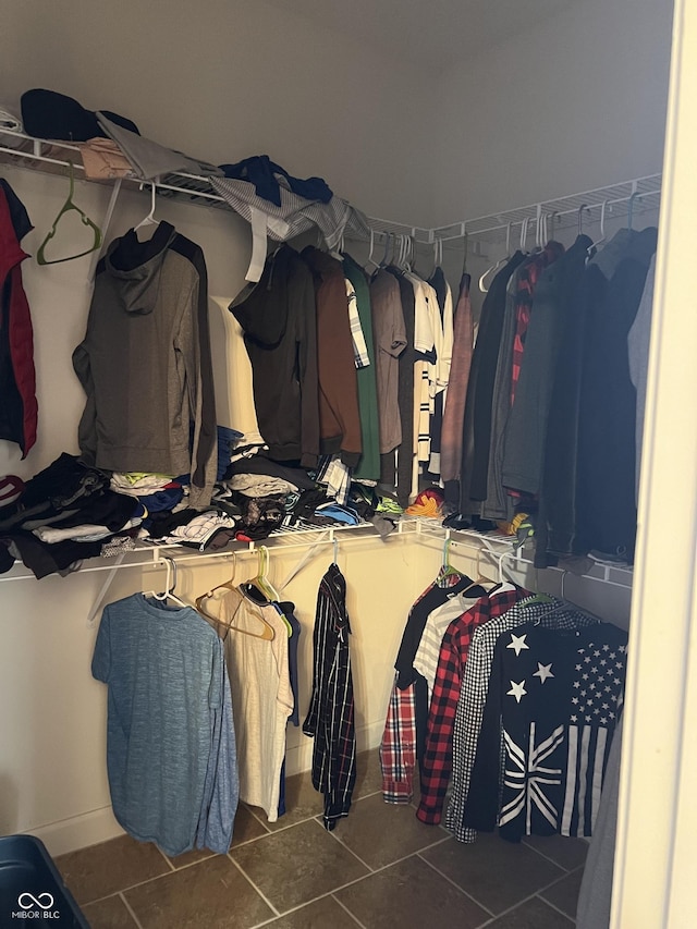 spacious closet with tile patterned floors