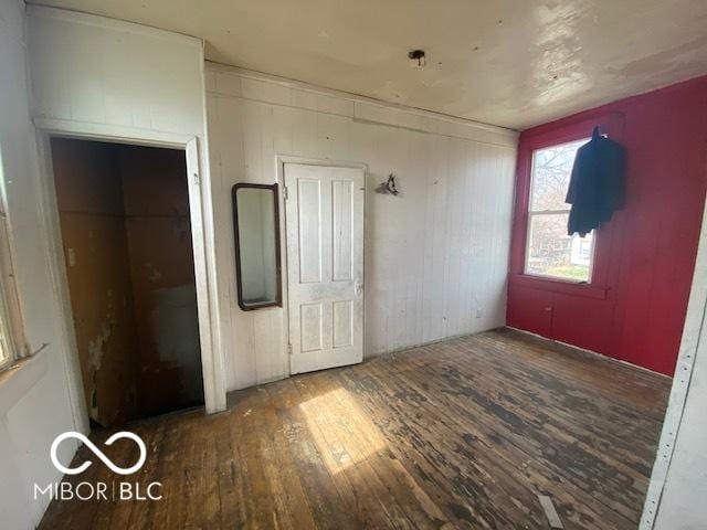 unfurnished bedroom featuring wood finished floors