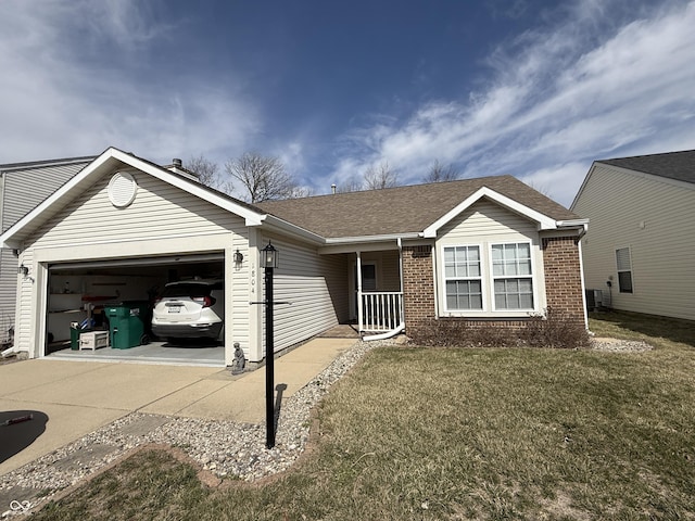 ranch-style home featuring a front yard, driveway, roof with shingles, a garage, and brick siding