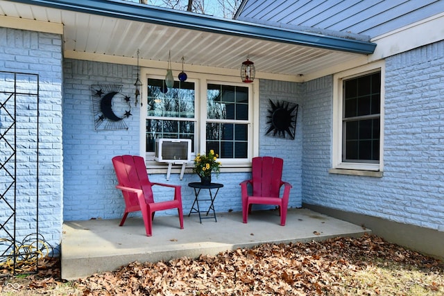 view of patio featuring covered porch and cooling unit