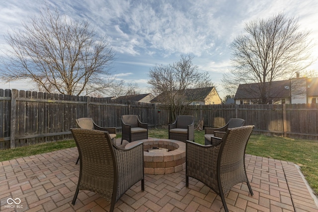 view of patio / terrace with a fire pit and a fenced backyard