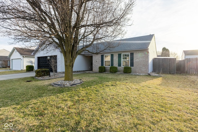 ranch-style house with a front yard, an attached garage, fence, and brick siding