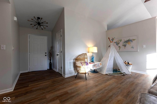 entryway with visible vents, baseboards, and wood finished floors